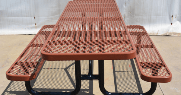 A Brown Picnic Table With Benches